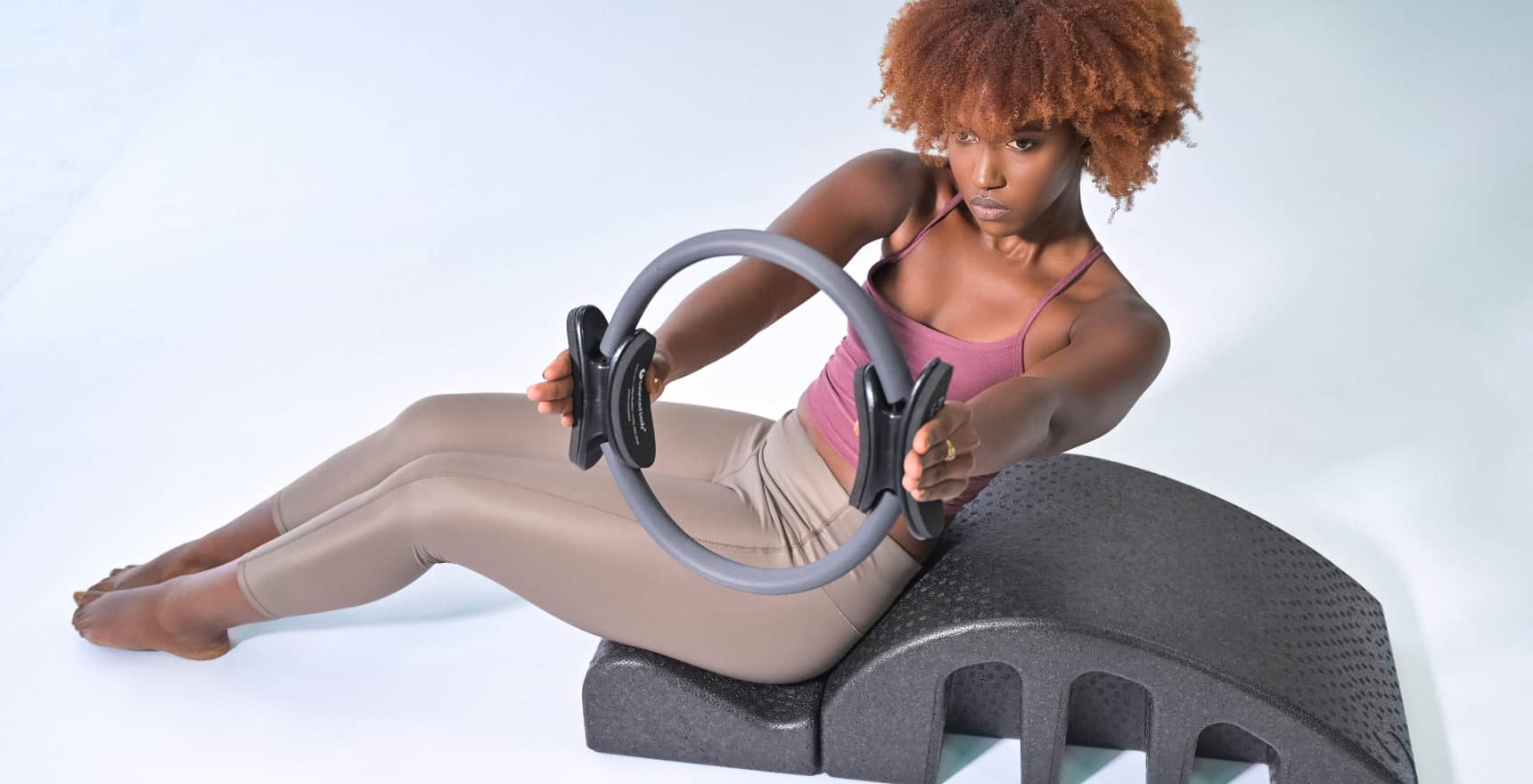 A Pilates arc and spine corrector barrel for gentle extension