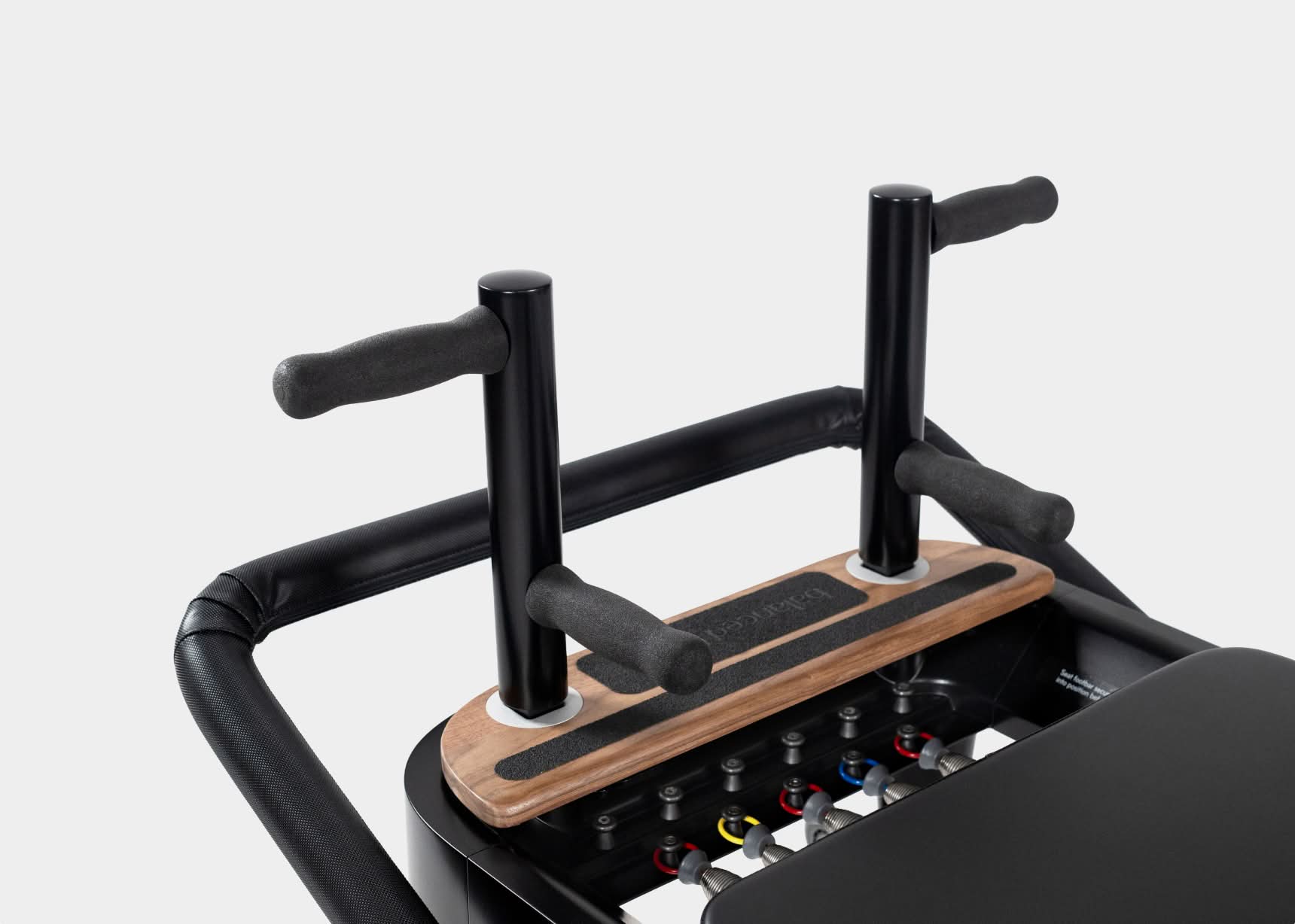 A close look at a premium Pilates reformer carriage and footbar