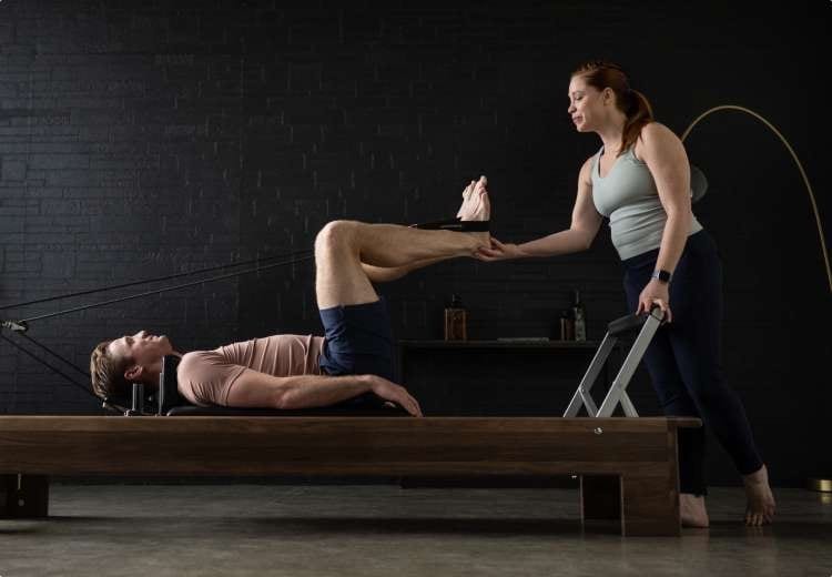 Reformer workout for flexibility — Pilates equipment reference photograph